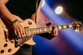 guy holding a guiter