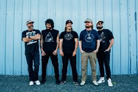 Band members standing together.